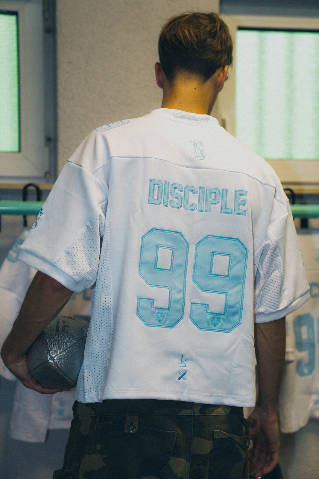 DISCIPLE 99 jersey, back view with a football